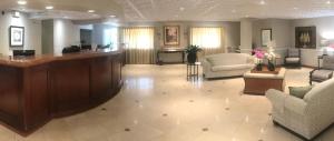 a large lobby with a reception desk and chairs at Hollywood Hotel in Los Angeles
