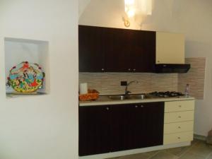 a kitchen with a sink and a counter top at resort san paolo in Modica