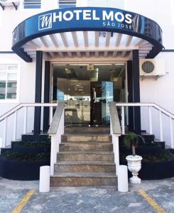 a hotel mots with stairs leading into a building at Hotel Mos São José in São José