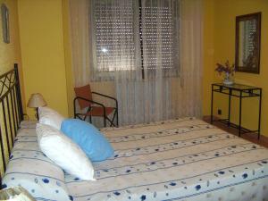 A bed or beds in a room at Vistas al mar y cerca de la playa
