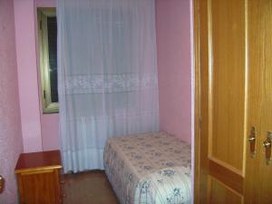 A bed or beds in a room at Vistas al mar y cerca de la playa