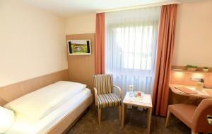 Postel nebo postele na pokoji v ubytování Hotel Waldlust