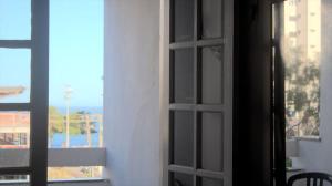 a view through a window of a house at Hotel Marlin Azul in Vila Velha