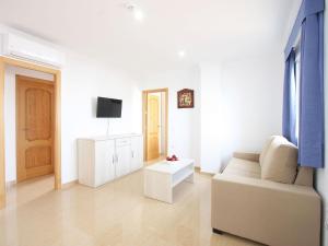 TV a/nebo společenská místnost v ubytování AReH Apartamentos