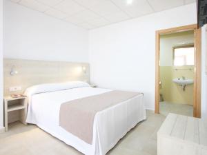 Postel nebo postele na pokoji v ubytování AReH Apartamentos