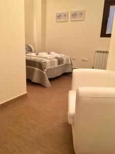 A bed or beds in a room at Apartamentos Rurales Flor De Lavanda