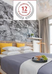 Postel nebo postele na pokoji v ubytování P&O City Center Apartments
