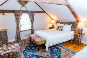 a bedroom with a bed and a window at Three Chimneys Inn in Durham