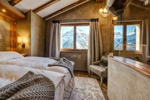 Postel nebo postele na pokoji v ubytování BelArosa Suiten & Wellness + 37 fotografií