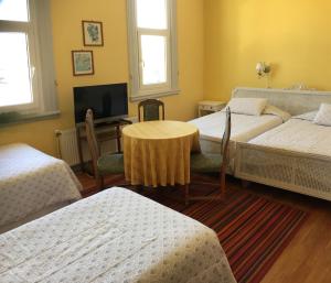 Cama ou camas em um quarto em Eco Hostal Offenbacher-Hof