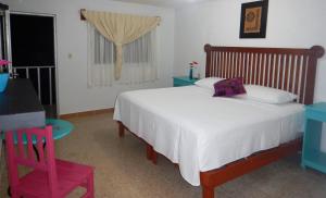 Cama ou camas em um quarto em Blue Coconut Cancun Hotel
