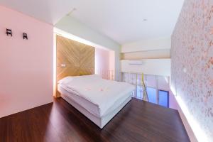 מיטה או מיטות בחדר ב-Chinhsi Homestay