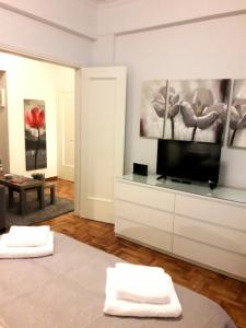 Postel nebo postele na pokoji v ubytování Stylish apartment in Kolonaki