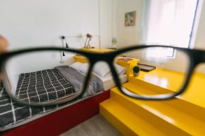 Postel nebo postele na pokoji v ubytování Aekkeko hostel