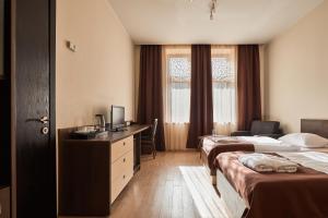 Voodi või voodid majutusasutuse Hotel Gino Wellness Rabath toas