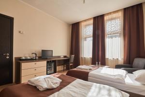Voodi või voodid majutusasutuse Hotel Gino Wellness Rabath toas