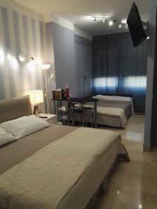 Postel nebo postele na pokoji v ubytování B&B Pescara Centro Luxury Suite