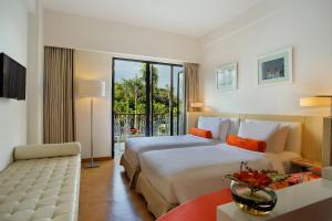 Voodi või voodid majutusasutuse HARRIS Hotel & Conventions Malang toas