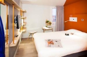 Postel nebo postele na pokoji v ubytování ibis budget Bordeaux Est Lormont + 33 fotografií