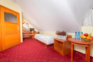 מיטה או מיטות בחדר ב-Hotel Bastion