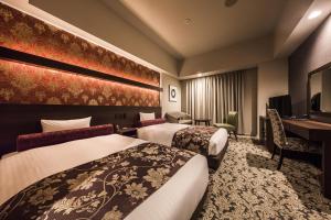 Llit o llits en una habitació de Hotel WBF Sapporo Chuo