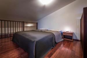 Una cama o camas en una habitación de Apartmány Snow v centre Starého Smokovca