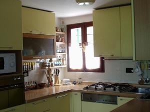 Kuchyň nebo kuchyňský kout v ubytování Bed and Room Al Fiume Piovego