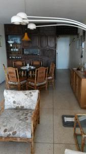 a living room with a table and chairs and a dining room at Torre Gorlero in Punta del Este