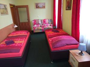 Postel nebo postele na pokoji v ubytování Guest House U Zámku