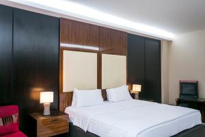 Ένα ή περισσότερα κρεβάτια σε δωμάτιο στο Lagos Oriental Hotel