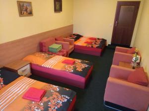 Postel nebo postele na pokoji v ubytování Guest House U Zámku