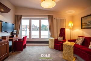 Televiisor ja/või meelelahutuskeskus majutusasutuses Hotel Kolb