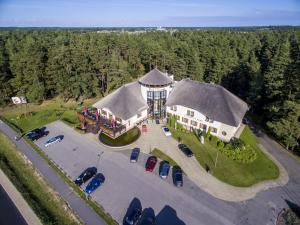 an aerial view of a house with a water tower at Port Hotel in Ādaži