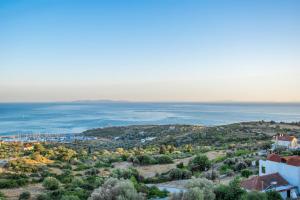 an aerial view of a city and the ocean at Saint Catherine Hotel in Pythagoreio