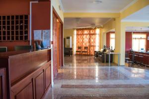 a large room with a kitchen and a living room at Saint Catherine Hotel in Pythagoreio