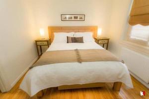 Rúm í herbergi á Innata Casa Hostal