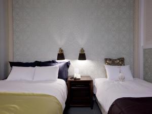 Postelja oz. postelje v sobi nastanitve Central Tourist Hotel