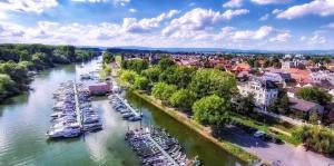 an aerial view of a river with boats docked at Hotel Peter Schaefer in Ginsheim-Gustavsburg +18 photos