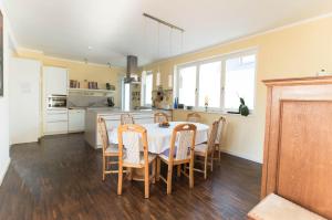 a kitchen and dining room with a table and chairs at Refugium-Luebeck in Lübeck