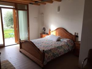 Кровать или кровати в номере Al Vajo Dependance - Apartments-Zimmer