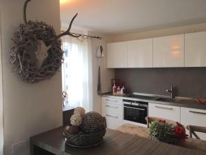 a kitchen with a table with a bowl on it at A casa di Romeo in Madesimo