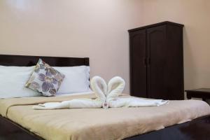Ein Bett oder Betten in einem Zimmer der Unterkunft Deparis Beach Resort