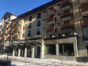 a building with balconies on the side of it at A casa di Romeo in Madesimo