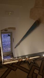 two baseball bats on the wall of a room at Casetta del Pescatore in Polignano a Mare