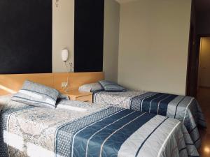 Cama o camas de una habitación en Hotel Viñas 17