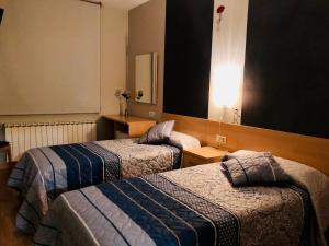 Cama o camas de una habitación en Hotel Viñas 17