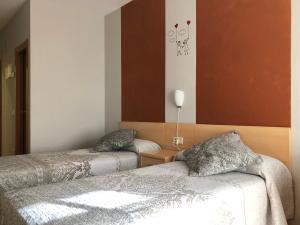 Cama o camas de una habitación en Hotel Viñas 17