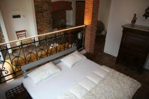 A bed or beds in a room at La Baita Dinner & Bed
