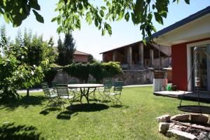 A garden outside La Baita Dinner & Bed