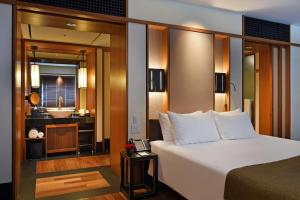 a hotel room with a bed and a bathroom at The Setai, Miami Beach in Miami Beach +49 photos